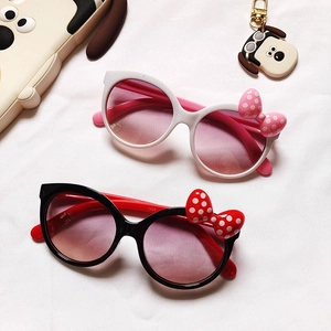 Bowtie cat-eye sunglasses for kids in red-black and pink-white polka dot frames
