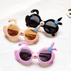 Cute cartoon bunny sunglasses for kids in black, cream, and lavender with rabbit ears