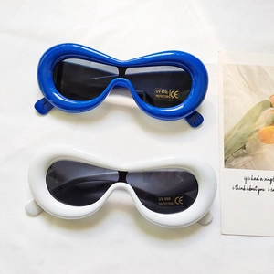 Macro shot of stylish bubble frame sunglasses with UV400 protection lens and CE label