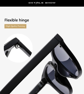 Detail view of high-quality black resin sunglasses featuring a flexible metal hinge