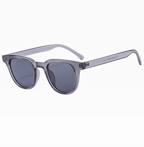 Detailed view of the precise metal hinge on translucent gray square frame sunglasses
