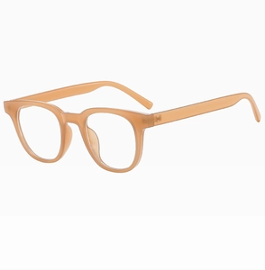Close-up detail of translucent amber square glasses frame with precise metal hinges