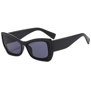 Retro oversized cat eye sunglasses with glossy black frames and dark grey lenses