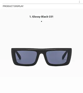 Close-up of bright black oversized rectangular sunglasses with blue-grey lenses
