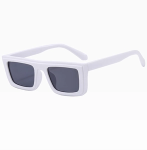 Detail of trendy square sunglasses with thick white resin frame and dark grey lenses