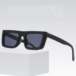 Classic black square frame sunglasses with dark grey lenses on a white display stand