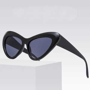 Stylish cat eye sunglasses with thick black frames and UV400 lenses on white display