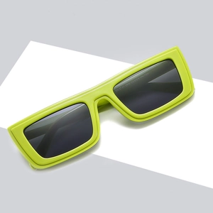 Neon green square sunglasses with dark UV lenses on minimalist geometric background