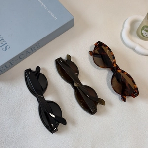 Three retro oval resin sunglasses in black, dark tortoiseshell and amber colors