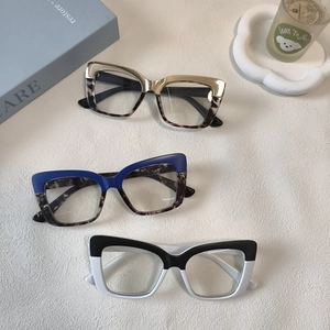 Three oversized cat-eye blue light blocking glasses in leopard print and bicolor styles