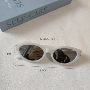 Vintage cat eye white oval sunglasses with black lenses and gold trim 32g lightweight