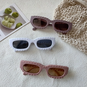 Modern square sunglasses with wavy textured frames in purple, white and pink colors