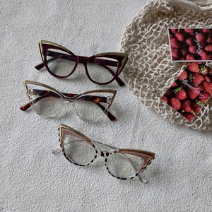 Cat eye glasses frames in burgundy and tortoiseshell with gold leaf metal details