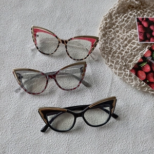 Cat-eye Y2K glasses with metal trim in tortoise, floral, and black frames