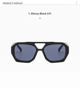 Detail view of irregular geometric black sunglasses with double bridge and metal decor