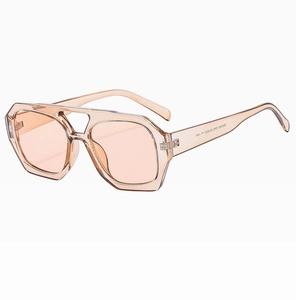 Detailed 45-degree angle of champagne polygon sunglasses with light tea lenses