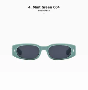 Detailansicht der mintgrünen Sonnenbrille mit ovalem Rahmen und silbernen Akzenten