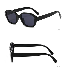 Detail view showing 45-degree and side profiles of retro oval sunglasses with silver studs