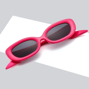 Retro hot pink rectangle sunglasses with thick glossy frames and dark grey lenses