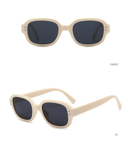 Front and 45-degree angle detail of retro oval cream sunglasses with black lenses