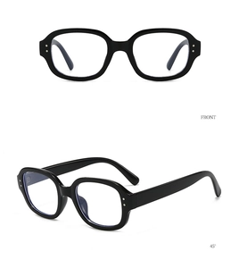Front and 45-degree angle views of black retro oval sunglasses with metal dot details