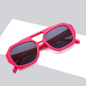 Hot pink geometric octagonal sunglasses with double bridge and black lenses