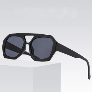 Modern geometric double bridge sunglasses with bold black frames and dark lenses