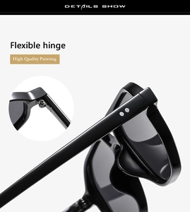 Detail showing flexible metal hinges and twin rivet decor on black polished sunglasses