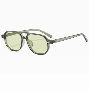 Detail of vintage double-bridge pilot sunglasses with grey green frames and yellow lenses