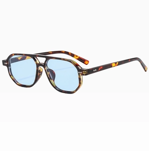 Detail of tortoise shell aviator frame with double bridge and light blue lenses