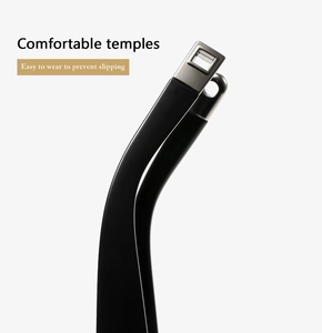 Macro detail of matte black glasses temples with silver metal inlay and ergonomic curve