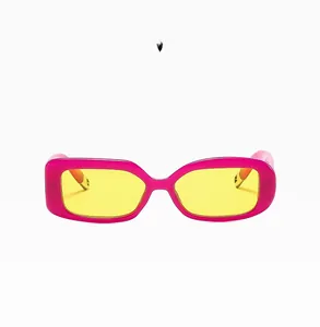 Detail of purple rectangular sunglasses with transparent yellow lenses and a glossy finish