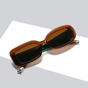 Retro rectangular amber sunglasses with contrasting dark green temples and silver metal accents