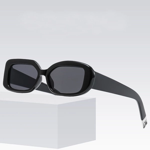 Asymmetric square and oval sunglasses in glossy black finish with wide temples