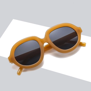 Oversized retro round sunglasses with honey amber frame and dark lenses for fashion style