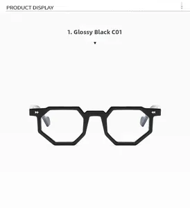 Detail view of glossy bright black irregular polygonal frame with silver geometric accents