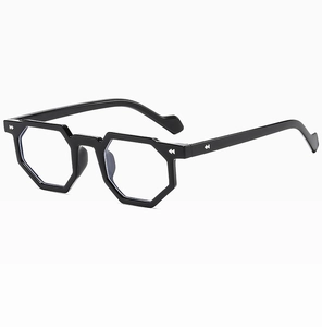 Detail of black hexagonal eyeglass frame with silver arrow rivets on a white background