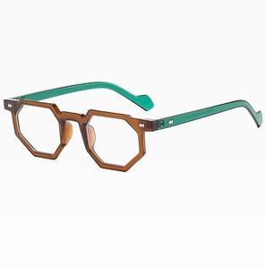 Detail view of geometric irregular glasses with amber frame and green temples