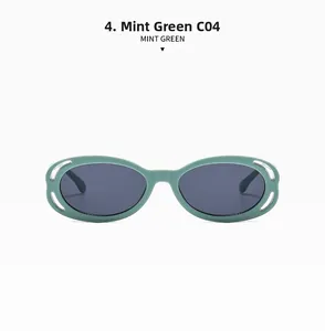 Détail de la monture de lunettes de soleil ovale ajourée vert menthe et verres foncés