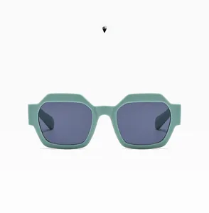 Detail view of mint green oversized geometric sunglasses with dark lenses and C04 design
