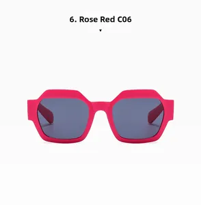 Detail of rose red square sunglasses frame with dark grey lenses and matte finish