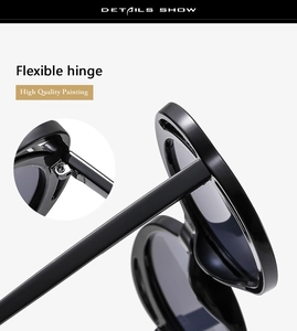 Detail view of flexible hinge on black oversized sunglasses with glossy finish
