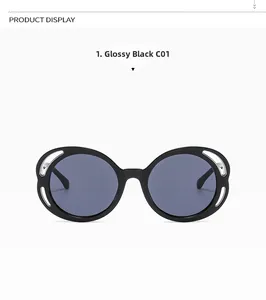 Detailed view of round black sunglasses with decorative silver hollowed metal accents