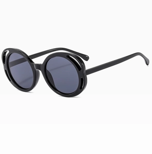 Side view of black round butterfly sunglasses with hollow floral pattern frames