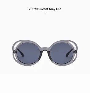 Detailed front view of transparent gray round sunglasses with trendy cutout frame design
