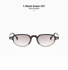 Détail de lunettes rétro ovales dégradé noir et vert avec des verres violets