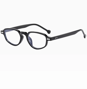 Détail de la monture de lunettes ovale noire vintage avec points argentés et verres anti-bleu