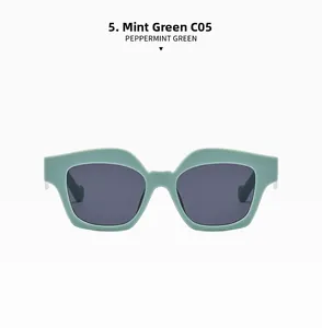Detail of peppermint green square sunglasses with dark lenses and thick frames