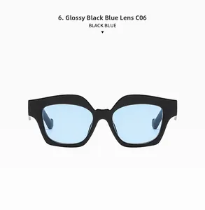 Close-up of oversized black square frame sunglasses with light blue lenses on white background