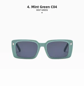 Detailansicht der minzgrünen quadratischen Sonnenbrille mit dunkelgrauen Gläsern und Nieten